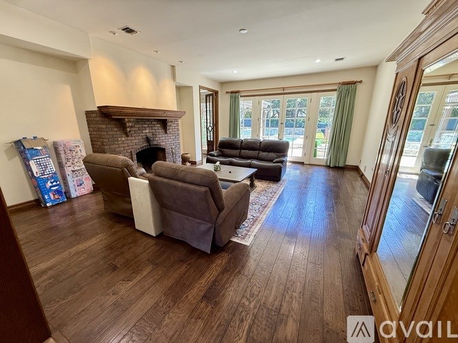 A living room with a fireplace and a couch.