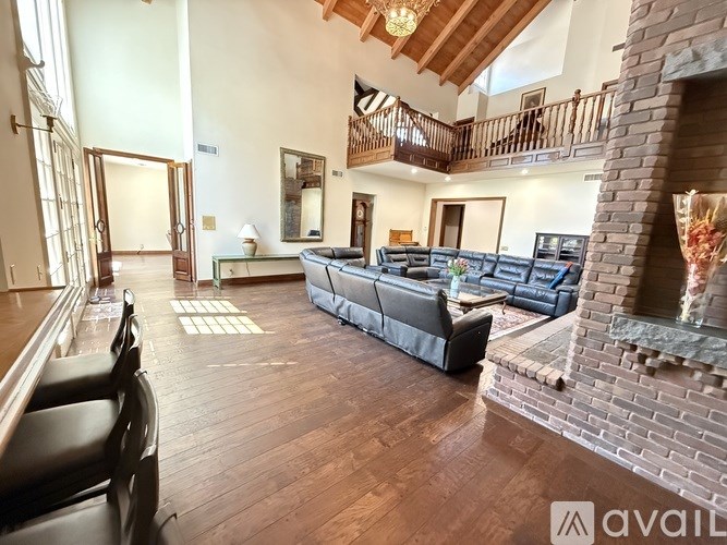 A living room with a fireplace and a couch.