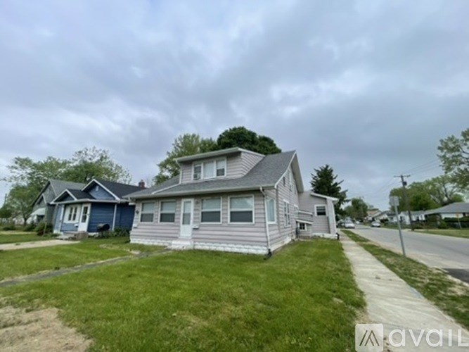 A house with a blue house in the background.