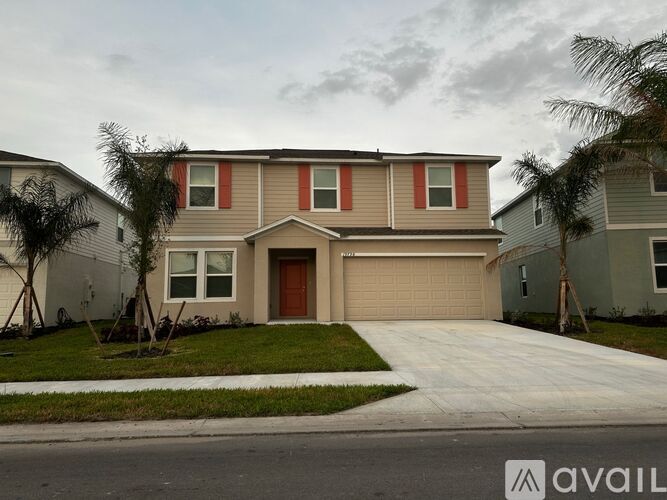 A house with a brown garage door is available for purchase.