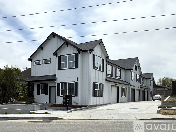 A row of houses with the first one being the largest.