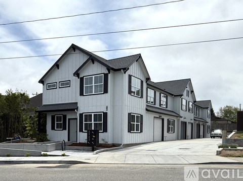 A row of houses with the first one being the largest.