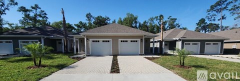 A house with a driveway in front of it.