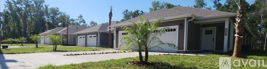 A row of houses with a sign that says "available" in front of the first one.