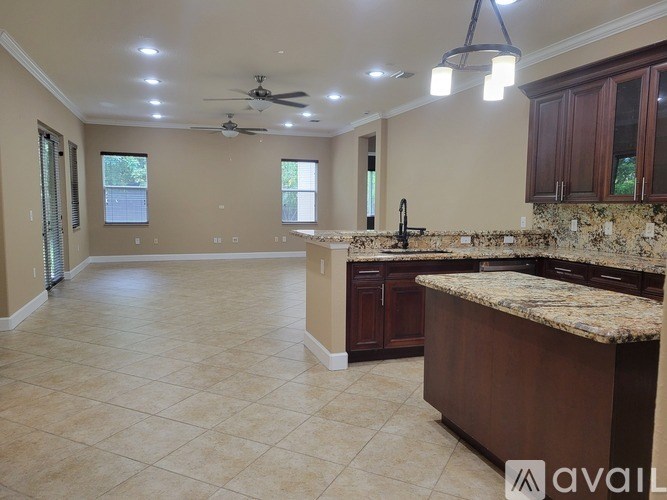 A bathroom with a toilet, sink, and shower.