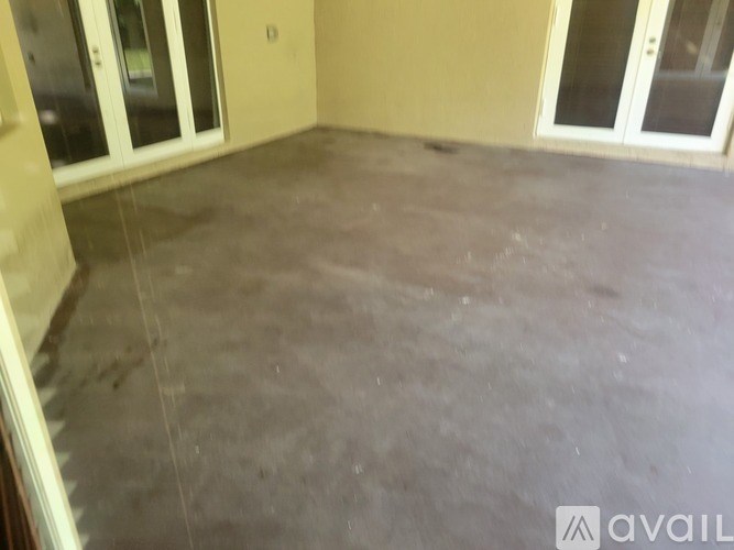 A room with a grey floor and white walls.