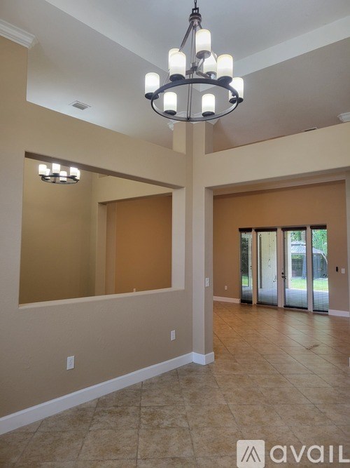 A bathroom vanity with a marble countertop and wooden cabinets.