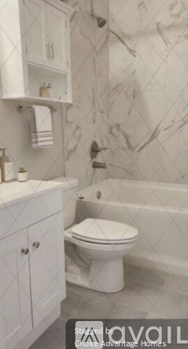 A white toilet sits in a bathroom with a marble wallpaper.