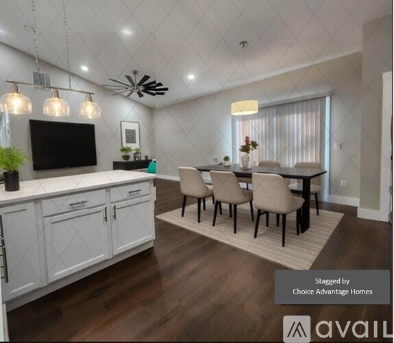 A modern kitchen with a dining table set up.
