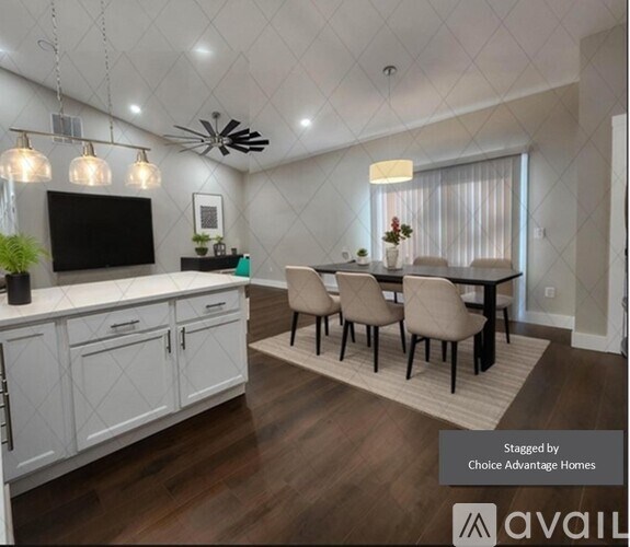 A modern kitchen with a dining table set up.
