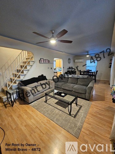 A living room with a couch and a coffee table.