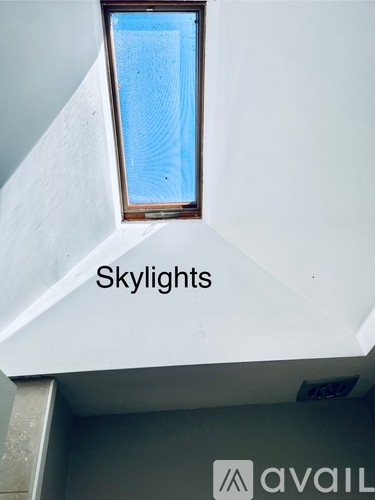 A skylight in a white building.