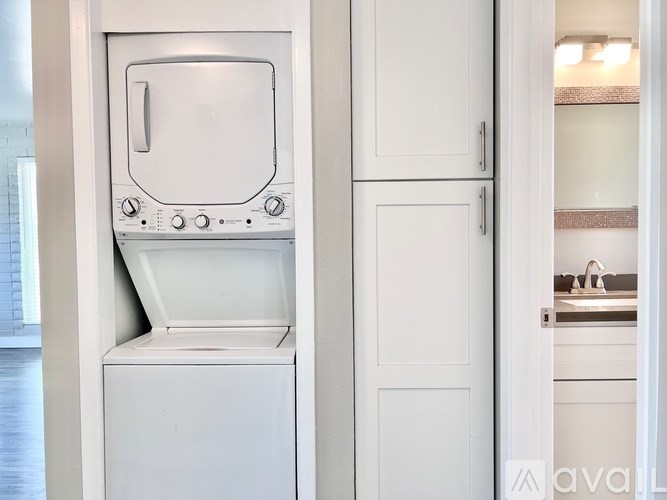 A white oven and dishwasher in a kitchen.