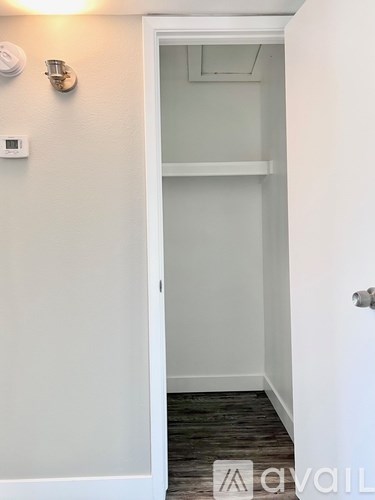 A white door with a small window above it.