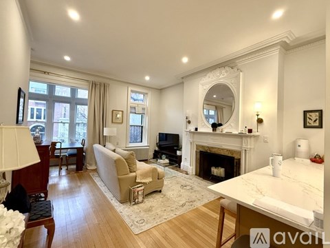 A kitchen with wooden cabinets and a stainless steel oven.