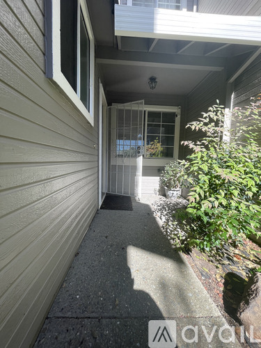 A house entrance with a mat on the ground.