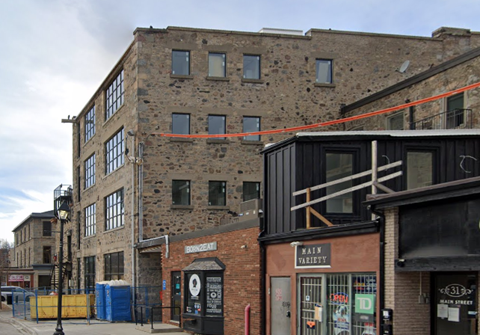 A brick building with a sign that says "Main Street Variety.".