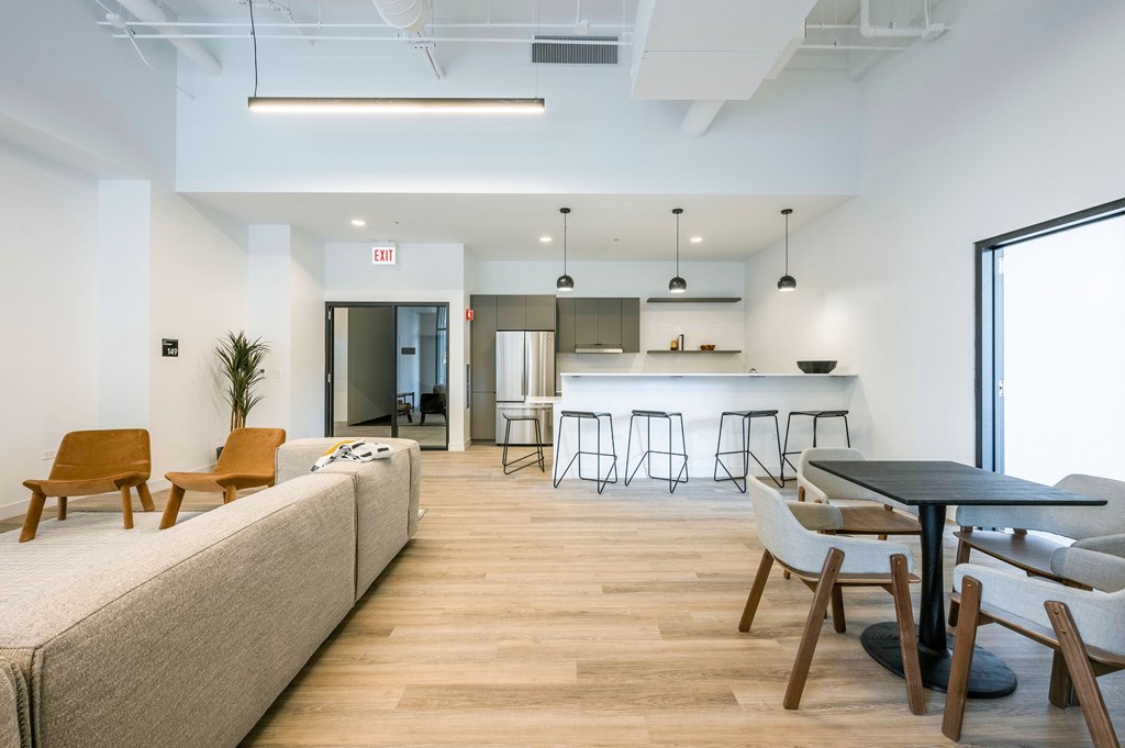A room with a long table and chairs.