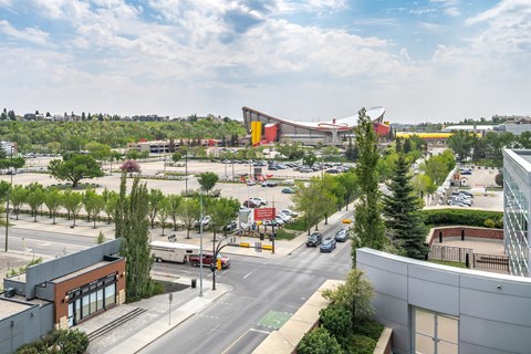 A view of a city street with cars and buildings.