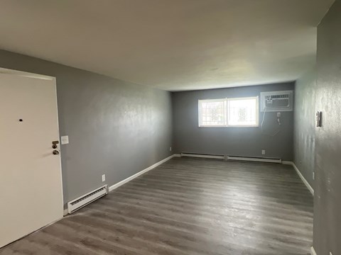 A room with a door and a window.