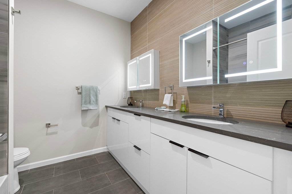 A modern bathroom with a towel hanging on the wall.