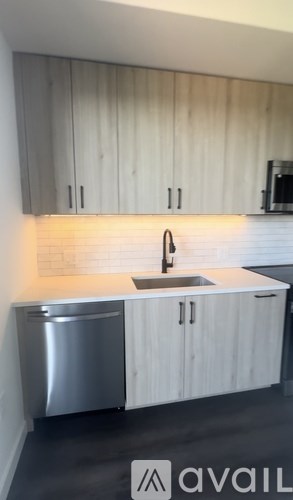 A kitchen with a sink and cabinets.