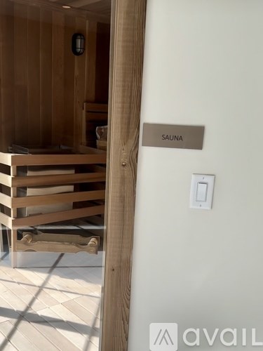 A Sauna sign is on the wall.