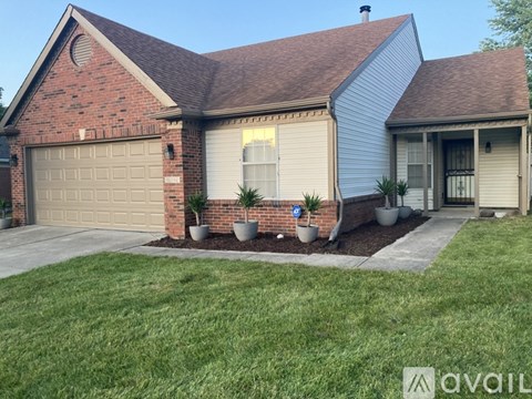 A house with a garage and a driveway.