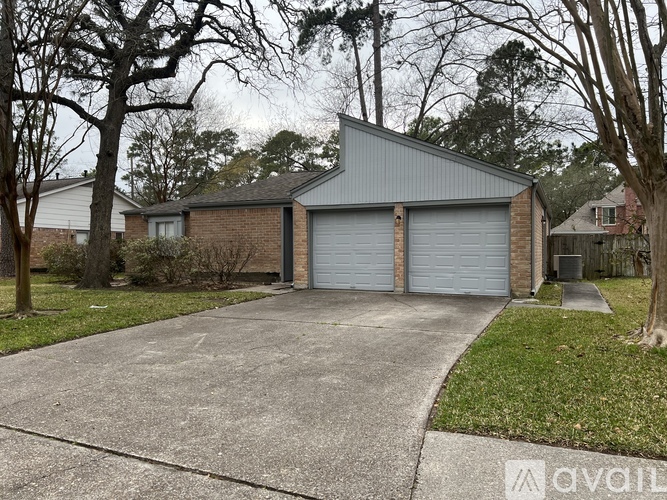 A two-car garage is attached to a house.