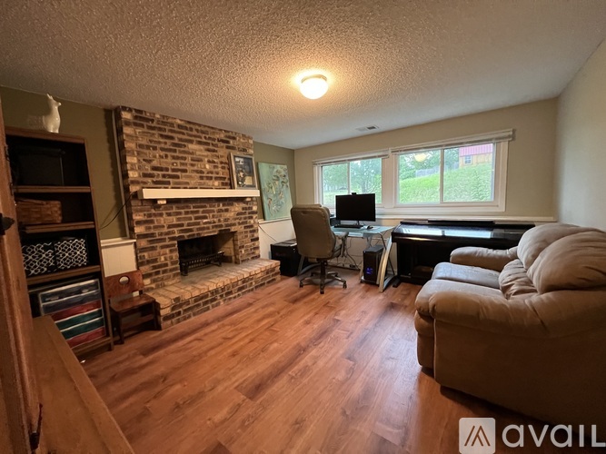A living room with a fireplace and a couch.