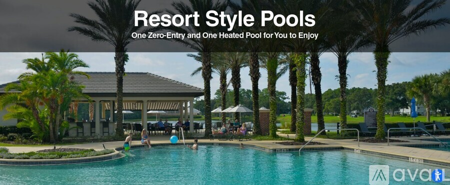 A resort style pool with people enjoying the water.