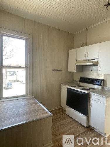 A kitchen with a stove and oven in it.
