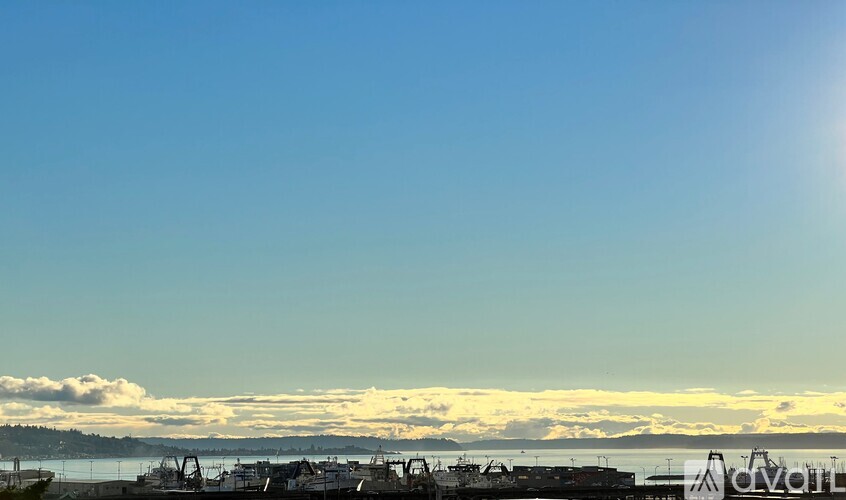 A sunny day at the harbor with boats and a clear blue sky.