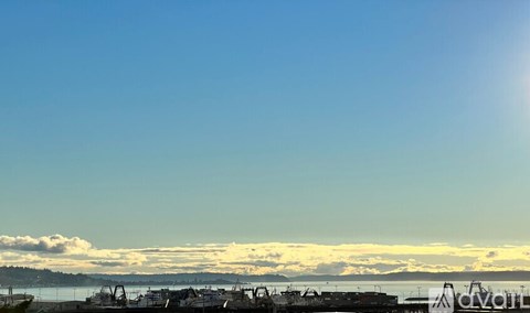 A sunny day at the harbor with boats and a clear blue sky.