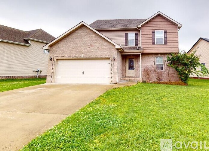A two-story house with a garage is for sale.