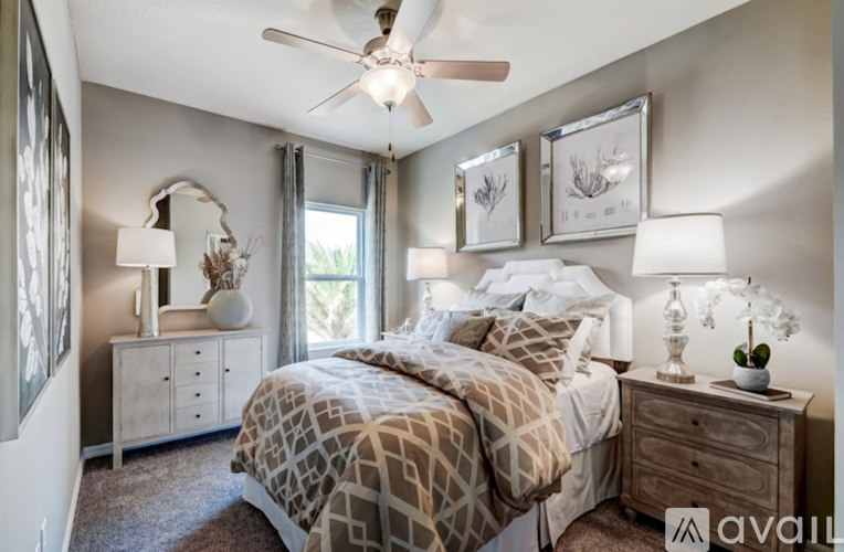 A bedroom with a bed, dresser, and mirror.