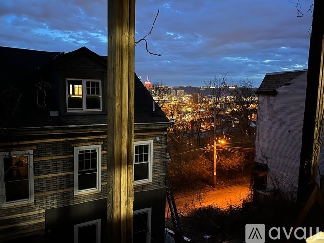 A view from a window of a city at night.