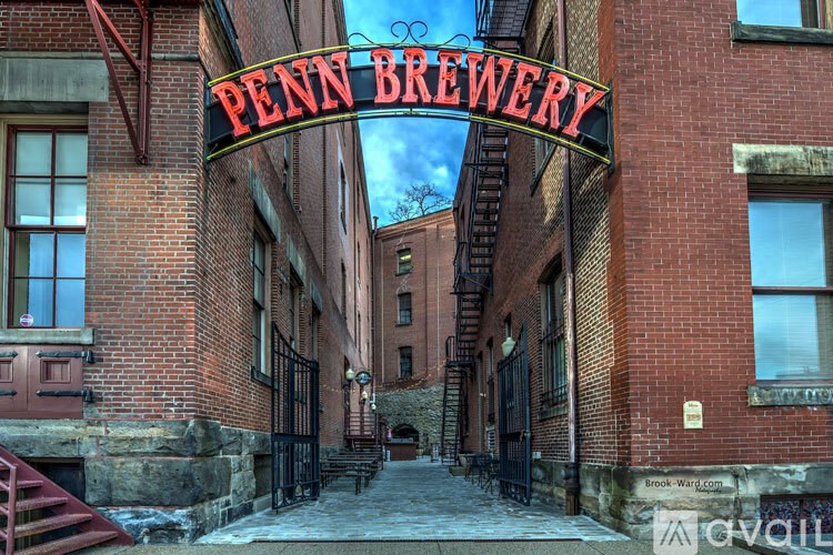 A brick building with a sign that says Penn Brewery.