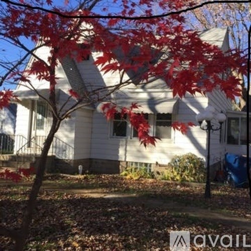 A house with a tree in front of it.