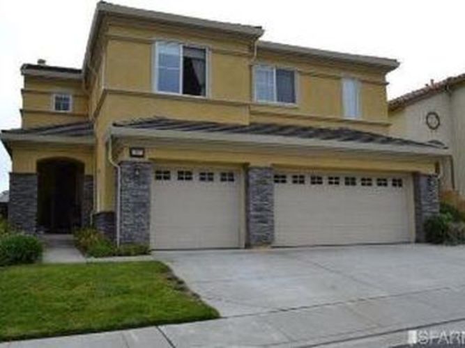 A two-story house with a garage on the ground floor.