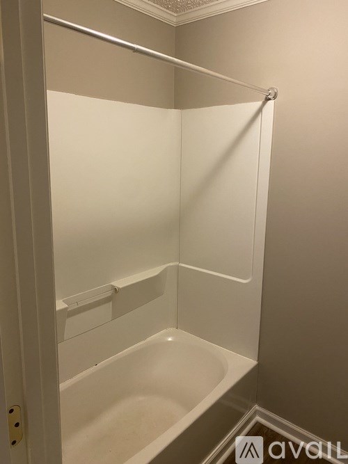 A white bathroom with a walk in shower.