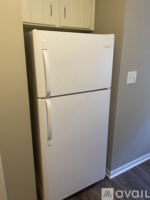 A white refrigerator in a kitchen.