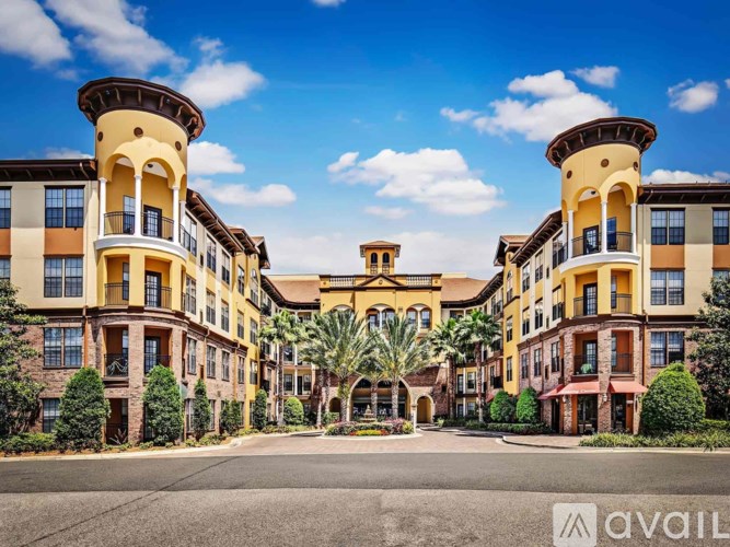 A large, multi-story building with a courtyard in the center.