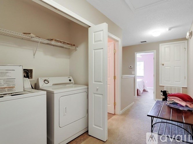 A laundry room with a washer and dryer.
