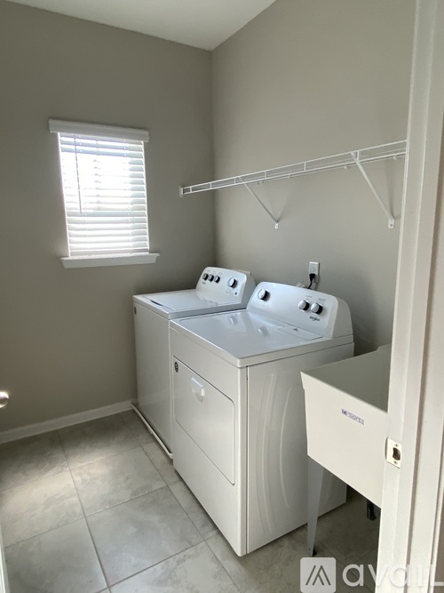 A small bathroom with a double sink vanity.