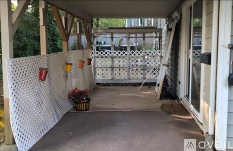 A white perforated fence with red lanterns on it.