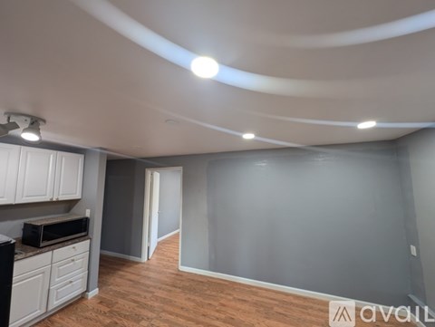 A kitchen area with a microwave and oven on the counter.