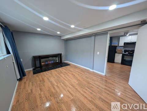 A living room with a fireplace and sliding glass doors.