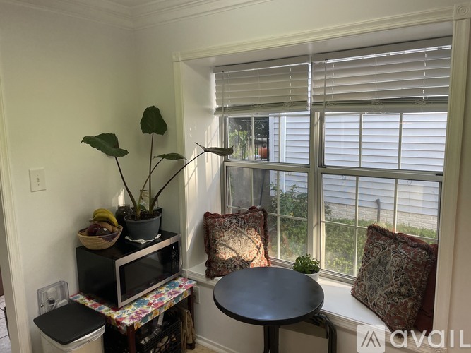 A living room with a brown table and a television.