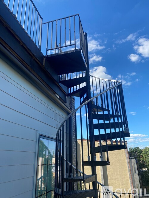 A metal staircase attached to a building.